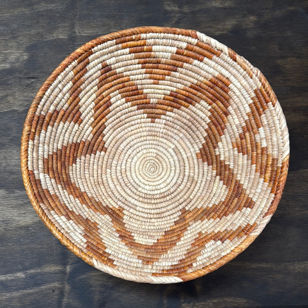 Handwoven basket with orange accent